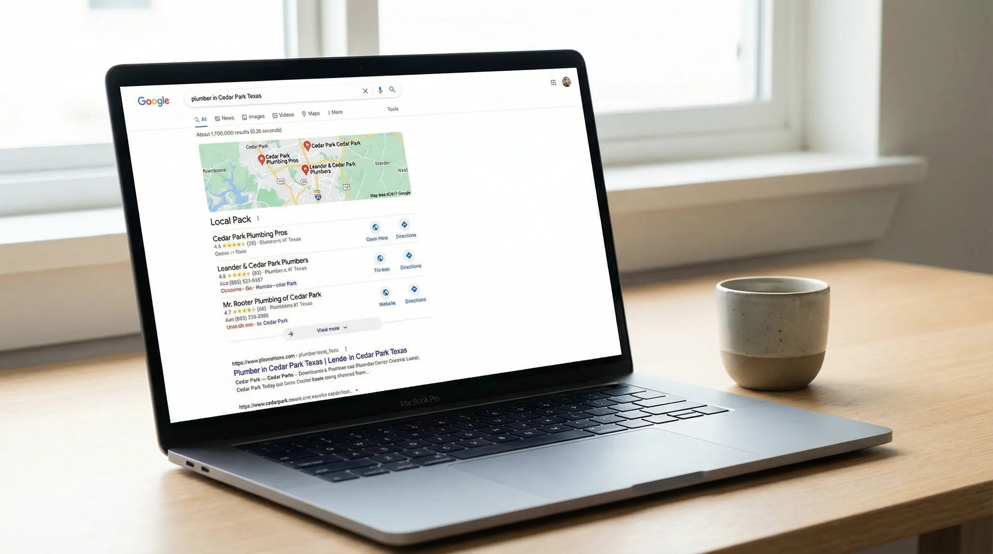 Google search results for a local service query on a laptop screen